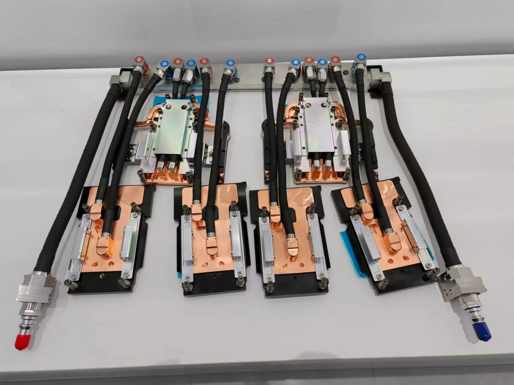 ToneCooling GB300 reference kit with four GPU cold plates, two CPU cold plates and adapter manifold